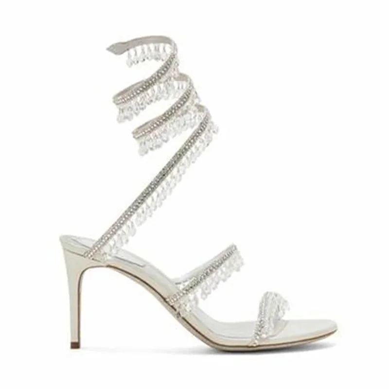 Elegant Moraima Snc White Leather Sandals - Summer High Heels with Crystal Tassels & Snake Pattern"